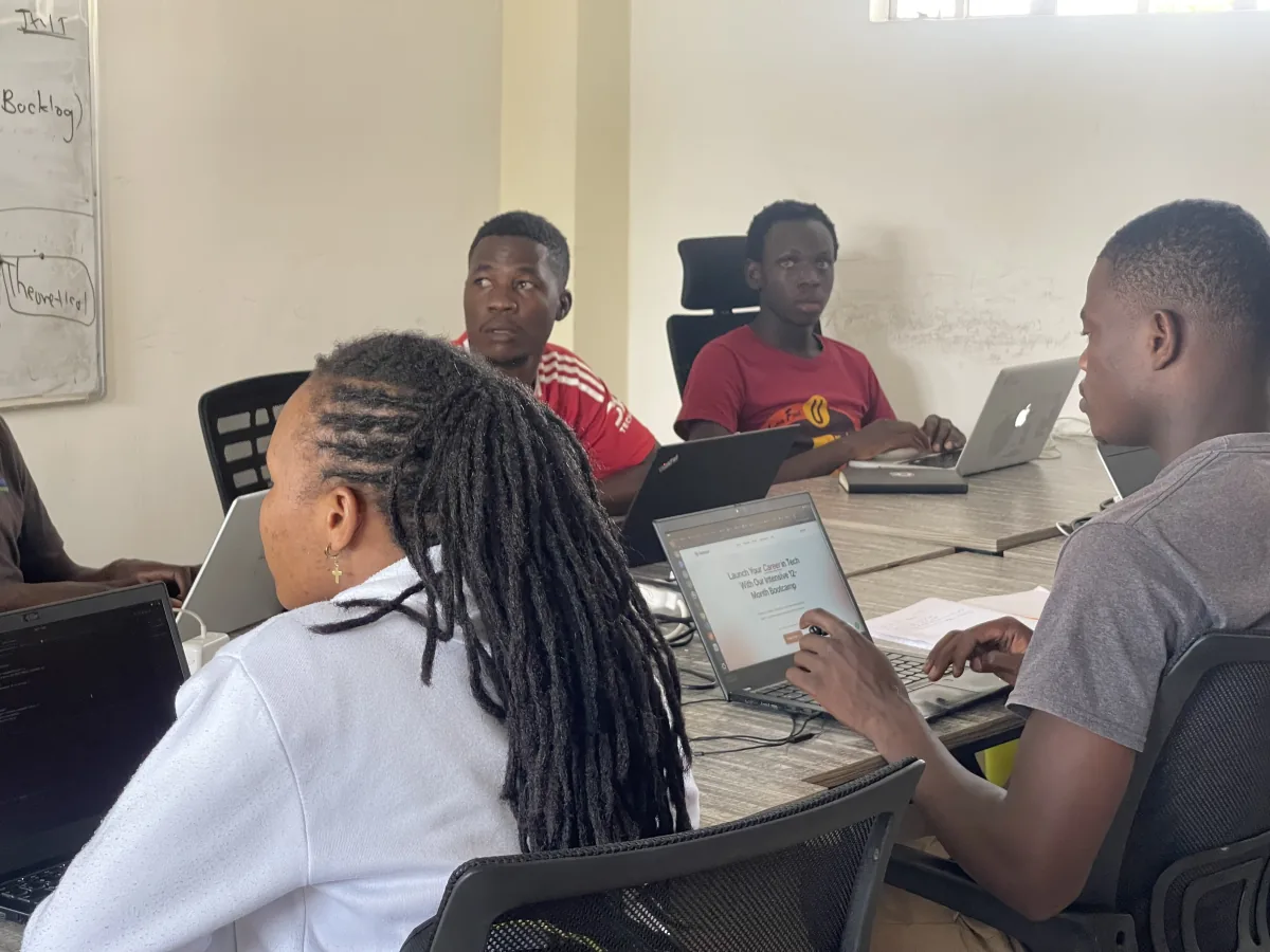 Students working with laptops in the institute classroom in Kisii